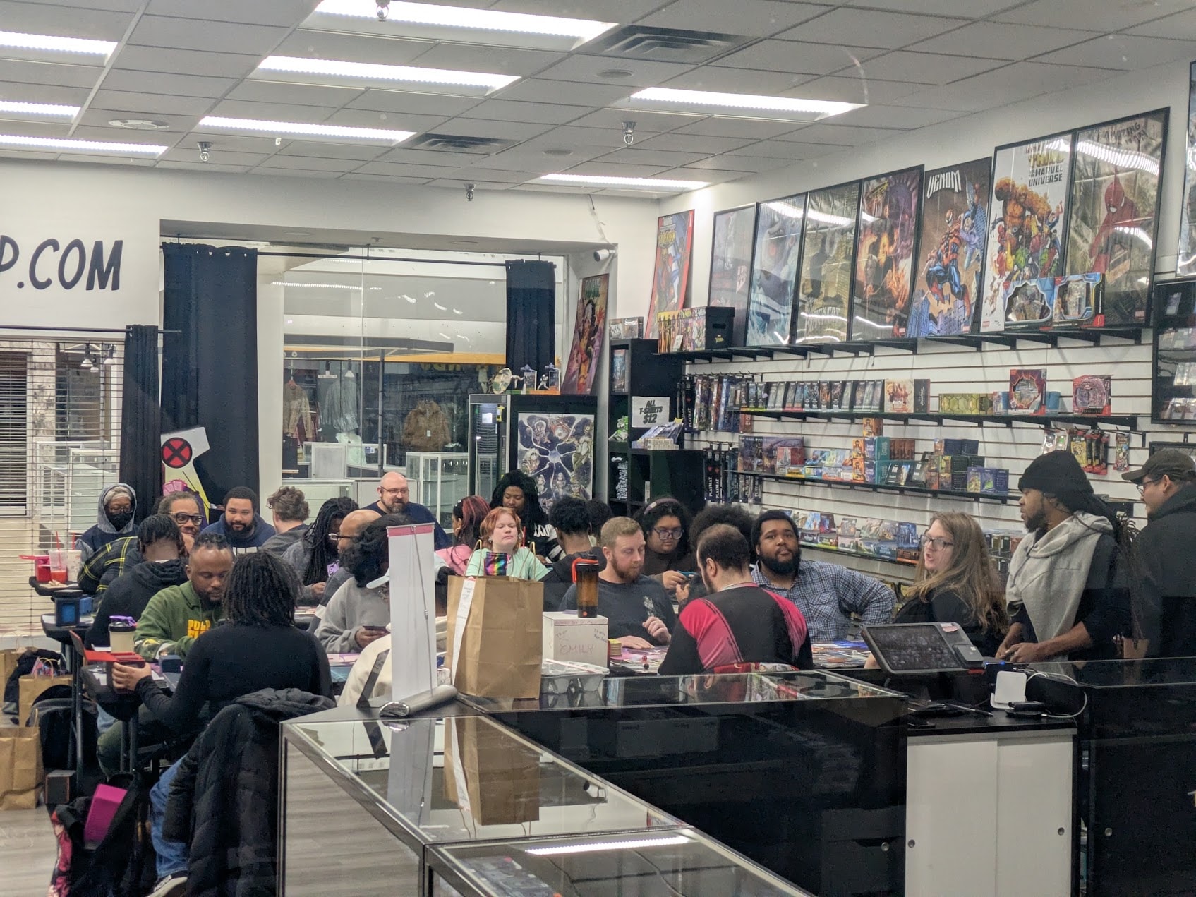 Community members playing card games together at Delta Cards